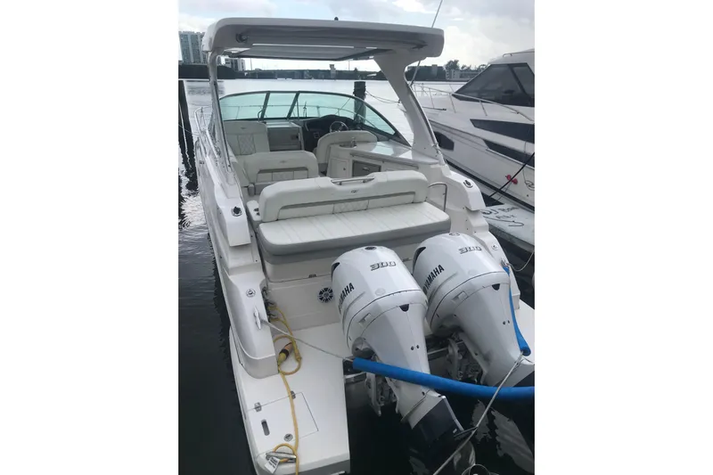  Yacht Photos Pics 2021 Regal 33 XO boat with dual Yamaha engines docked at marina.