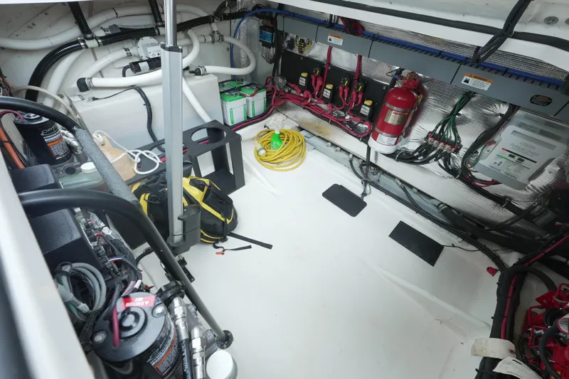  Yacht Photos Pics Engine room of a 2021 Regal 33 XO boat, featuring wiring and equipment.