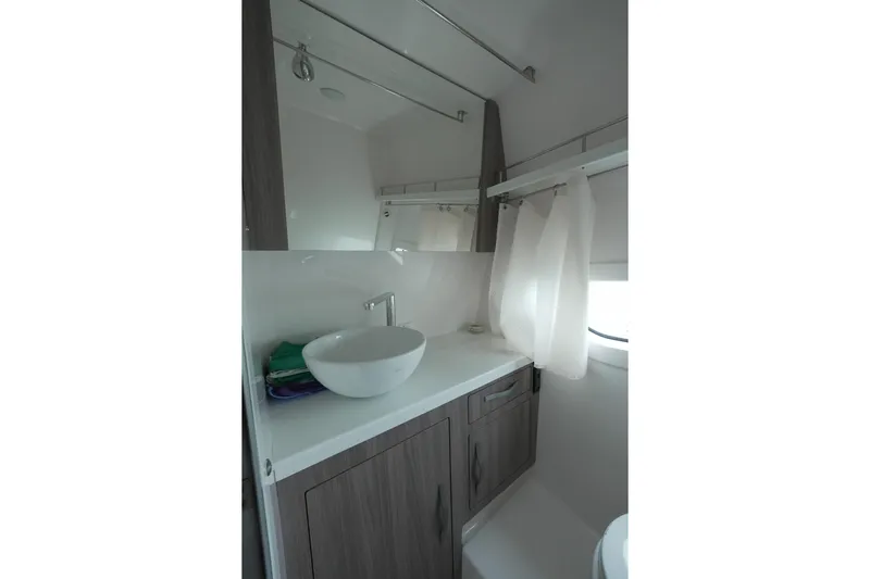  Yacht Photos Pics 2021 Regal 33 XO boat bathroom with modern sink and cabinetry.