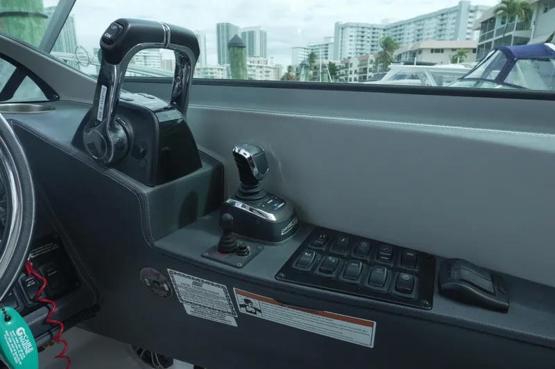  Yacht Photos Pics Control panel of 2021 Regal 33 XO boat with throttle and joystick.