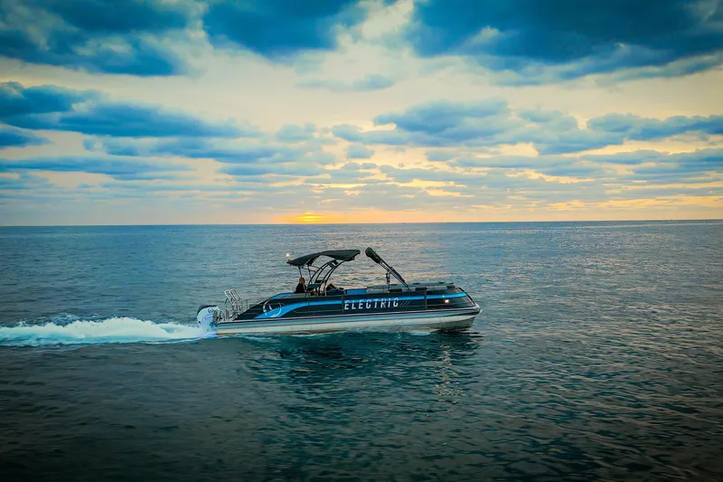  Yacht Photos Pics Electric Vision Marine Technologies V30 boat cruising at sunset, 2025 model.