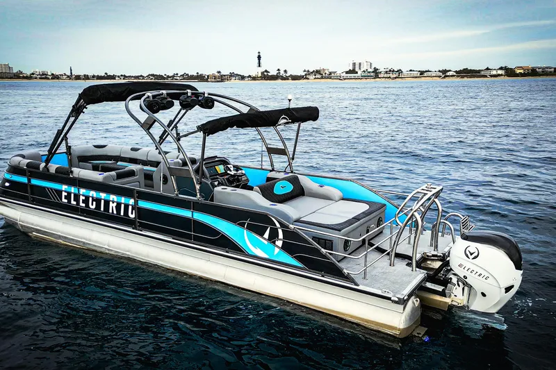 Yacht Photos Pics Electric Vision Marine Technologies V30 boat on water, showcasing sleek design and modern features.