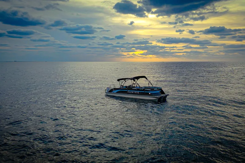  Yacht Photos Pics Electric Vision Marine Technologies V30 boat on serene ocean at sunset, 2025 model.