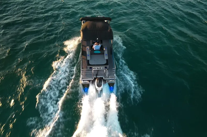  Yacht Photos Pics Aerial view of Vision Marine Technologies V30 boat cruising on open water, 2025 model.