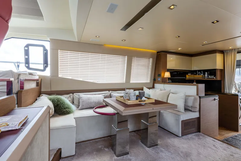  Yacht Photos Pics Luxurious interior of 2017 Beneteau Monte Carlo 6S yacht with modern seating and dining area.