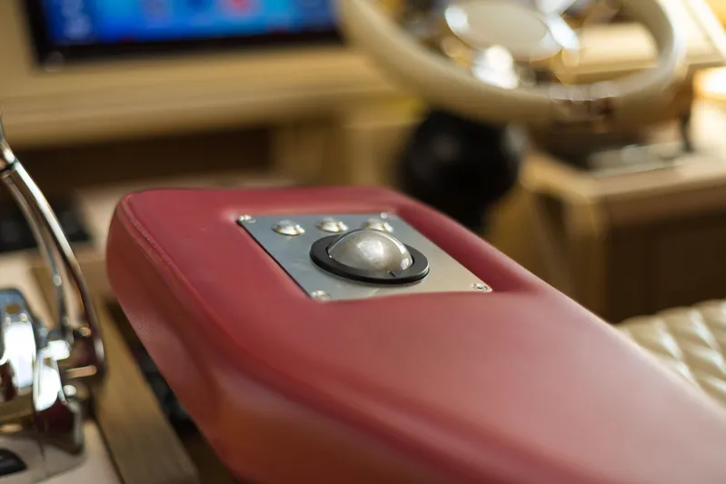  Yacht Photos Pics Control panel of 2017 Beneteau Monte Carlo 6S yacht with red leather detail.