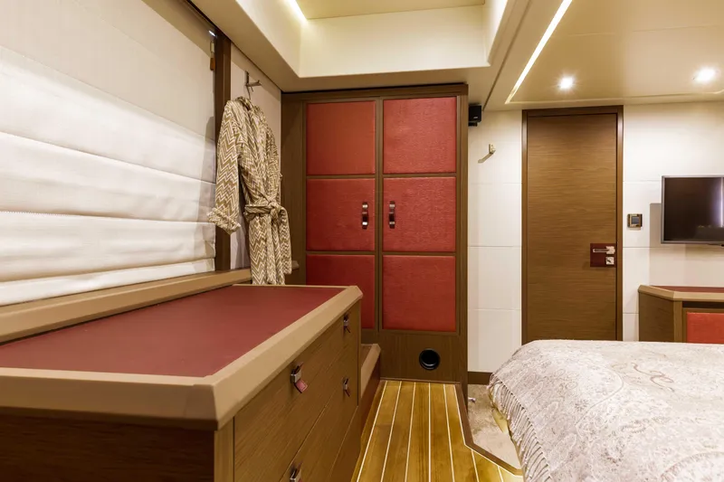  Yacht Photos Pics Luxurious interior of 2017 Beneteau Monte Carlo 6S yacht cabin with elegant wood finishes.