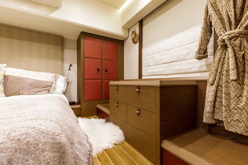  Yacht Photos Pics Luxurious bedroom interior of 2017 Beneteau Monte Carlo 6S yacht with elegant furnishings.