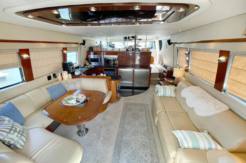 Susea Q Yacht Photos Pics Luxurious interior of a 2005 Carver 560 Voyager yacht with elegant seating and modern amenities.