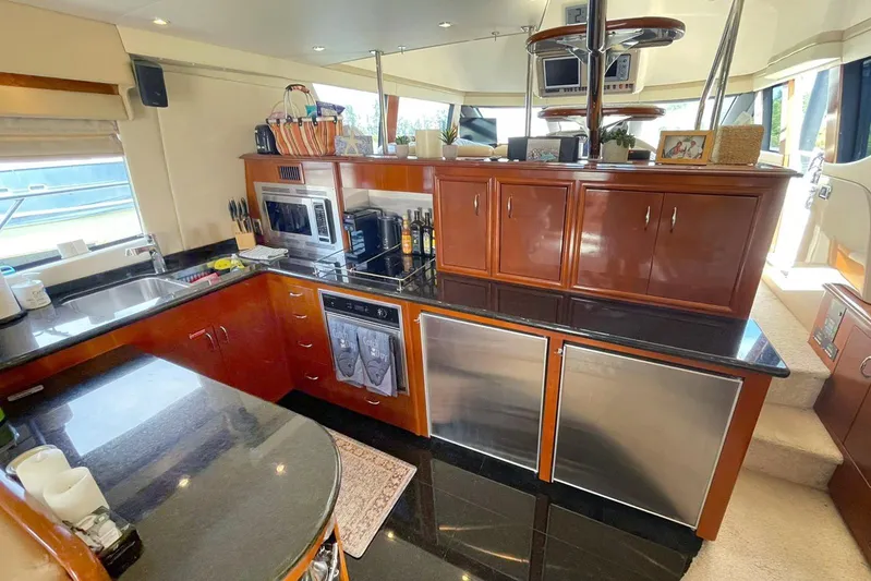 Susea Q Yacht Photos Pics Luxurious kitchen interior of 2005 Carver 560 Voyager yacht with modern appliances.
