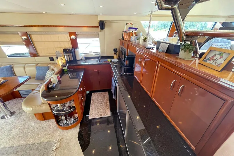 Susea Q Yacht Photos Pics Luxurious interior of a 2005 Carver 560 Voyager yacht with elegant wood finishes.