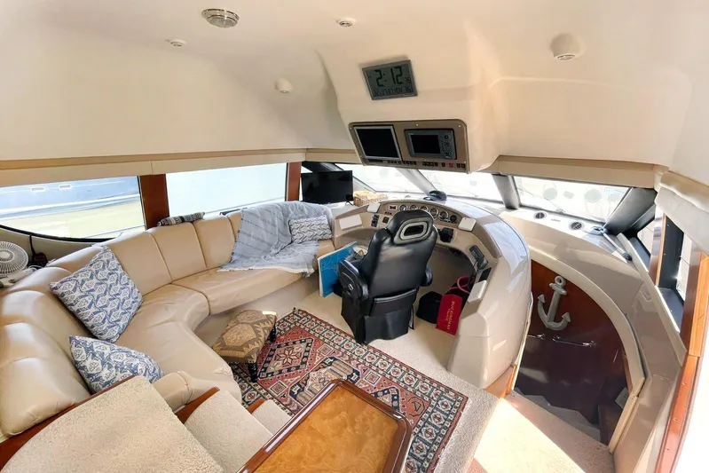 Susea Q Yacht Photos Pics Luxurious interior of 2005 Carver 560 Voyager yacht with helm and seating area.