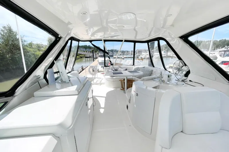 Susea Q Yacht Photos Pics Luxurious interior of 2005 Carver 560 Voyager yacht with spacious seating and panoramic windows.