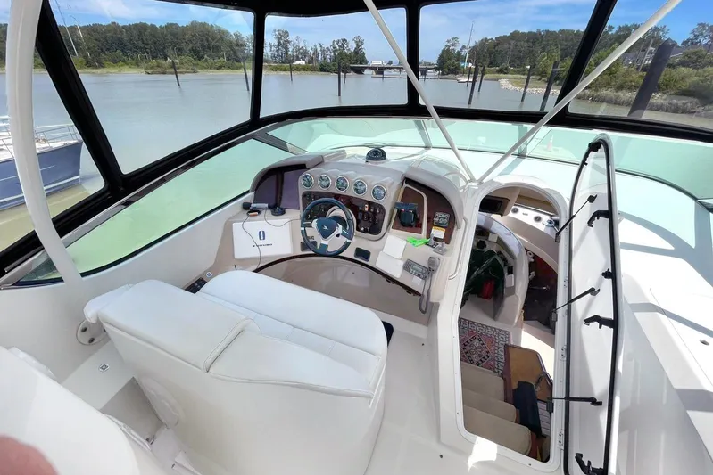Susea Q Yacht Photos Pics 2005 Carver 560 Voyager helm with modern controls and panoramic river view.