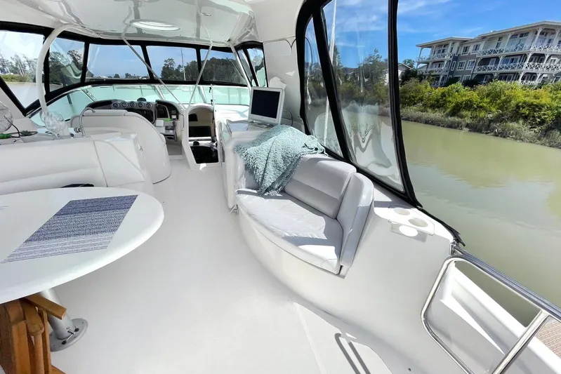Susea Q Yacht Photos Pics Luxurious interior of 2005 Carver 560 Voyager yacht with modern seating and scenic views.
