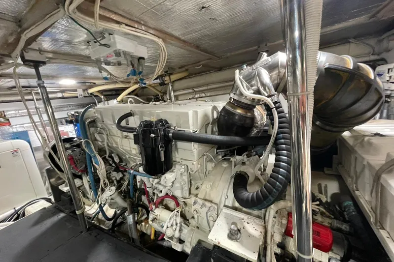 Susea Q Yacht Photos Pics Engine room of a 2005 Carver 560 Voyager yacht, showcasing complex machinery.