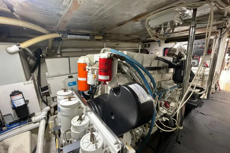 Susea Q Yacht Photos Pics Engine room of 2005 Carver 560 Voyager yacht, showcasing mechanical components and wiring.