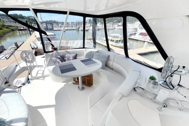 Susea Q Yacht Photos Pics Luxurious 2005 Carver 560 Voyager yacht interior with elegant seating and marina view.