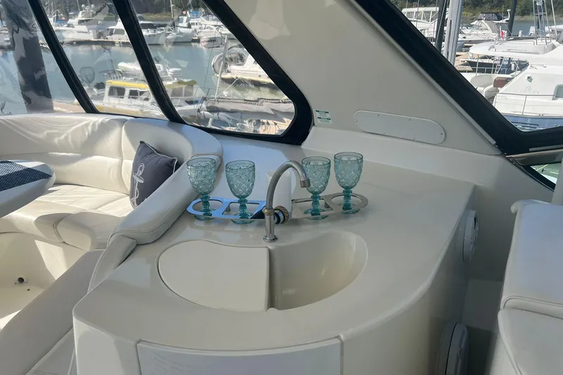 Susea Q Yacht Photos Pics Luxurious interior of 2005 Carver 560 Voyager yacht with elegant seating and glassware.