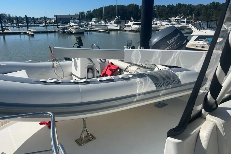 Susea Q Yacht Photos Pics 2005 Carver 560 Voyager with Novurania tender and Yamaha motor at marina.