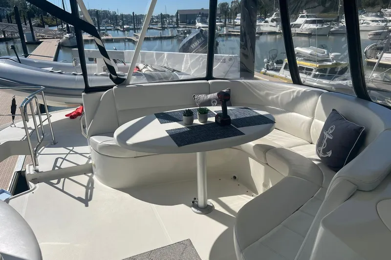 Susea Q Yacht Photos Pics Luxurious 2005 Carver 560 Voyager yacht interior with elegant seating and marina view.