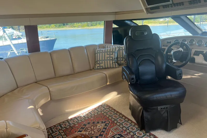 Susea Q Yacht Photos Pics Luxurious interior of 2005 Carver 560 Voyager yacht with leather seating and helm.