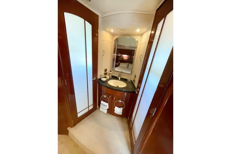 Susea Q Yacht Photos Pics Luxurious bathroom interior of 2005 Carver 560 Voyager yacht with elegant wood finishes.