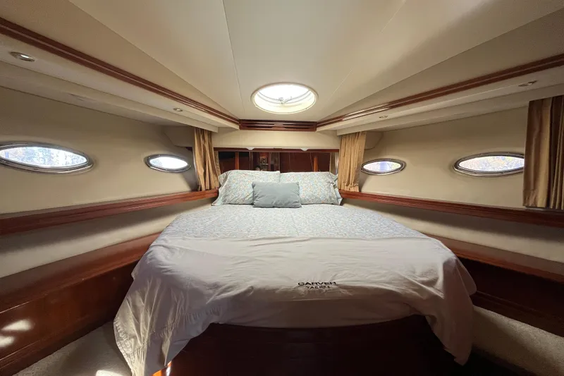 Susea Q Yacht Photos Pics Luxurious bedroom interior of 2005 Carver 560 Voyager yacht with elegant bedding.