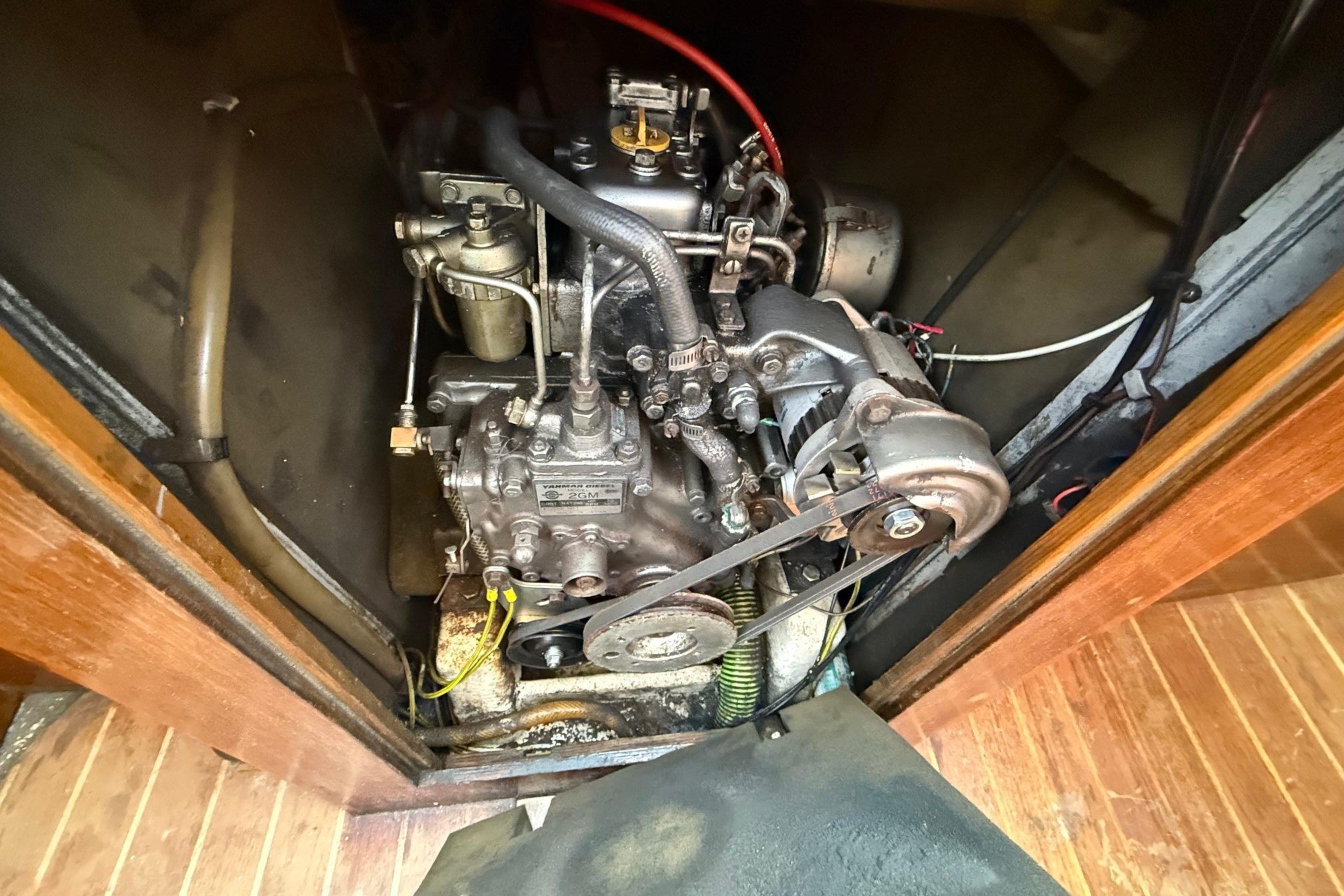 Engine compartment of a 1984 Trapper T30 sailboat, showcasing mechanical components.