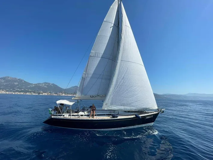  Yacht Photos Pics Sailing yacht Grand Soleil 43, 2002 model, cruising on clear blue waters.