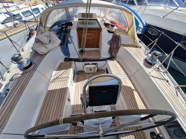  Yacht Photos Pics Cockpit of 2002 Grand Soleil 43 sailboat with wooden deck and steering wheel.