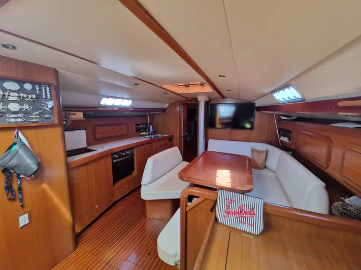  Yacht Photos Pics Interior of 2002 Grand Soleil 43 yacht with wooden finish and modern amenities.