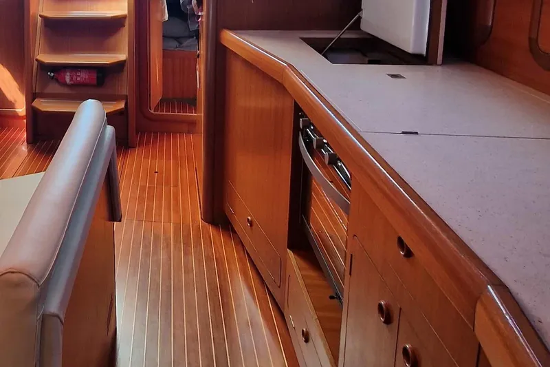  Yacht Photos Pics Interior of 2002 Grand Soleil 43 yacht with wooden cabinetry and seating.