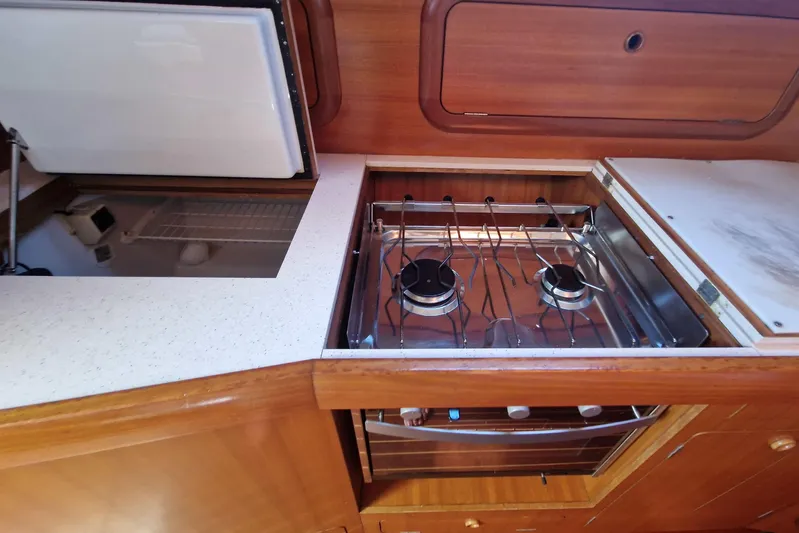  Yacht Photos Pics Kitchen area of 2002 Grand Soleil 43 yacht with stove and storage.