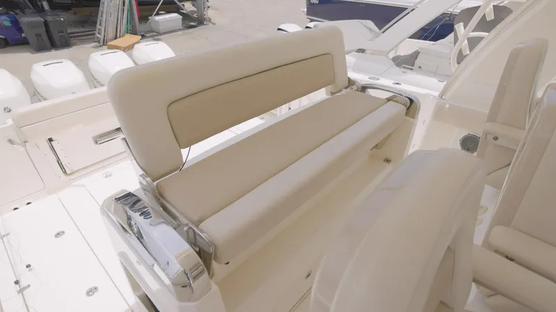  Yacht Photos Pics 2016 Boston Whaler 420 Outrage boat seating area with beige cushions.