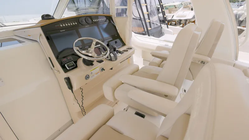 Yacht Photos Pics 2016 Boston Whaler 420 Outrage helm with luxurious seating and advanced navigation controls.