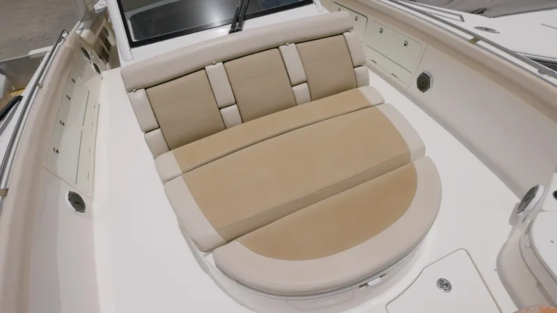  Yacht Photos Pics 2016 Boston Whaler 420 Outrage boat with beige cushioned seating area.