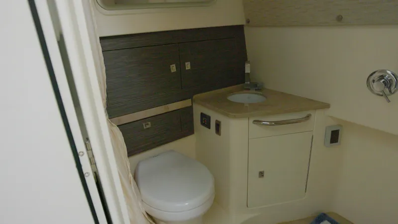  Yacht Photos Pics 2016 Boston Whaler 420 Outrage boat bathroom with sink and toilet.
