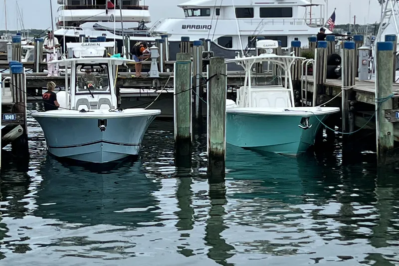  Yacht Photos Pics Two 2022 Regulator 34 boats docked at a marina.
