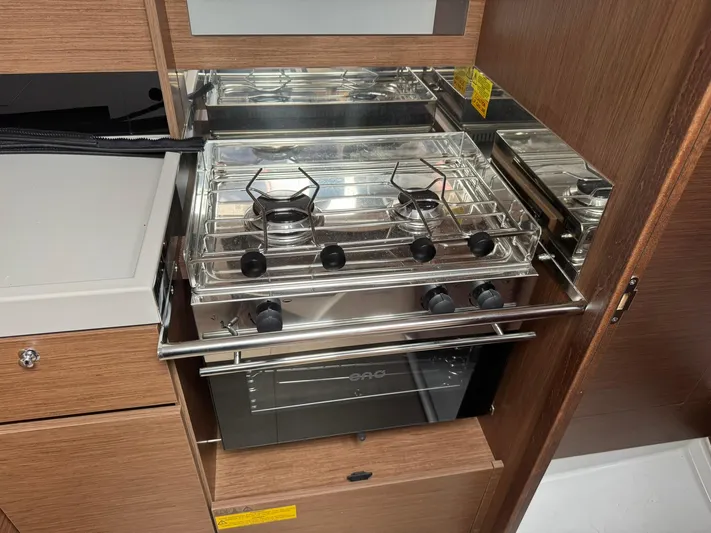 Xanadu Yacht Photos Pics 2024 Beneteau Oceanis 34.1 yacht kitchen with stainless steel stove and oven.