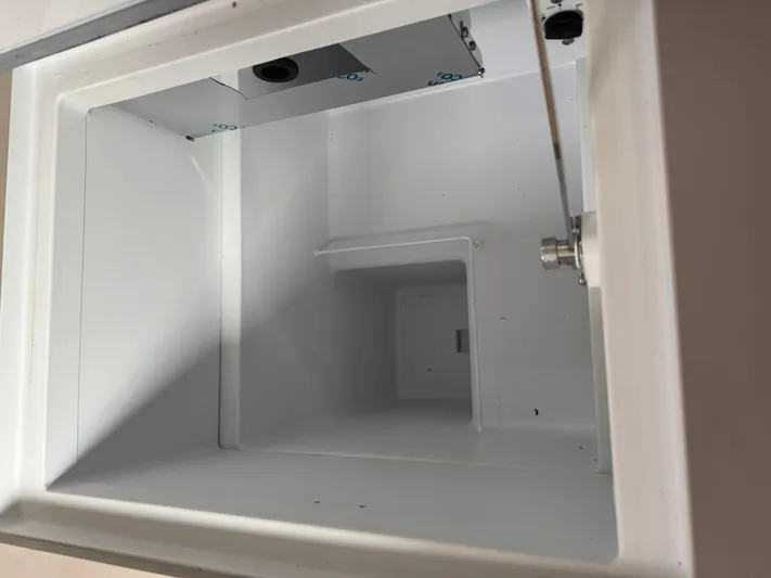 Xanadu Yacht Photos Pics Interior compartment of 2024 Beneteau Oceanis 34.1 sailboat, showcasing storage space.