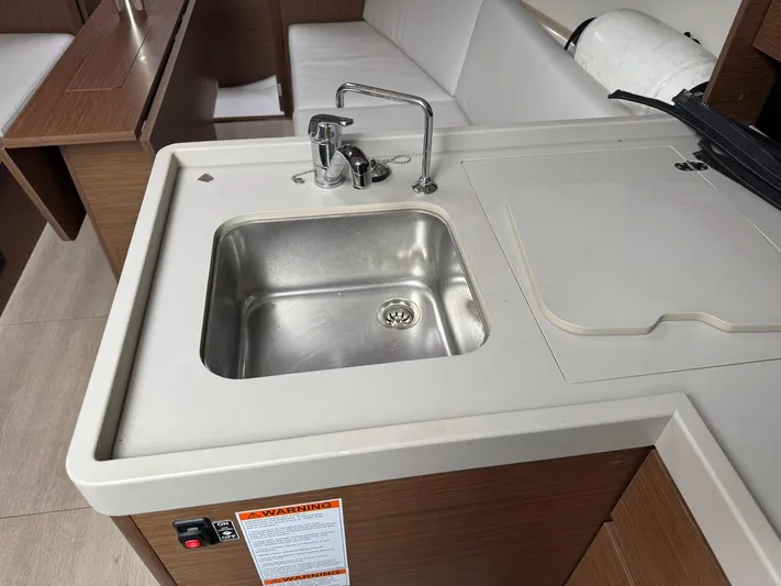 Xanadu Yacht Photos Pics 2024 Beneteau Oceanis 34.1 yacht interior with modern kitchen sink and faucet.