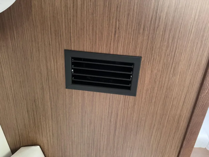 Xanadu Yacht Photos Pics Vent on wooden panel inside 2024 Beneteau Oceanis 34.1 yacht.