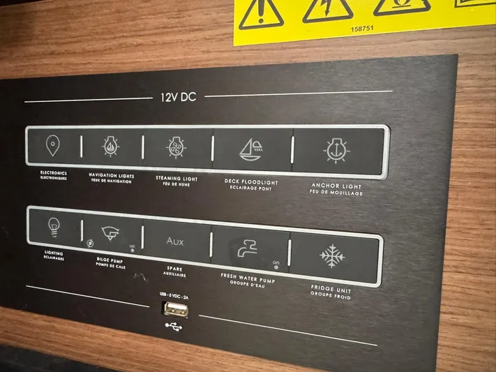 Xanadu Yacht Photos Pics Control panel of 2024 Beneteau Oceanis 34.1 yacht with labeled switches and indicators.