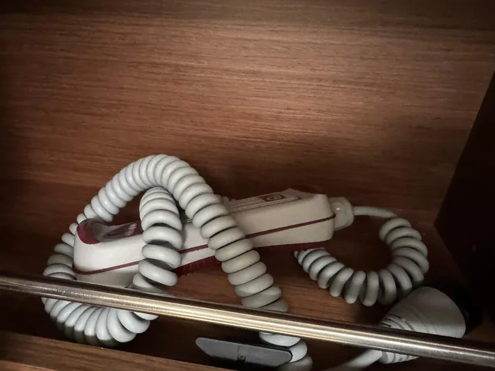 Xanadu Yacht Photos Pics Coiled white cable in wooden compartment on Beneteau Oceanis 34.1, 2024 model.