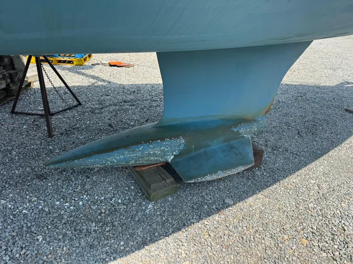 Xanadu Yacht Photos Pics 2024 Beneteau Oceanis 34.1 keel on gravel, showing wear and marine growth.