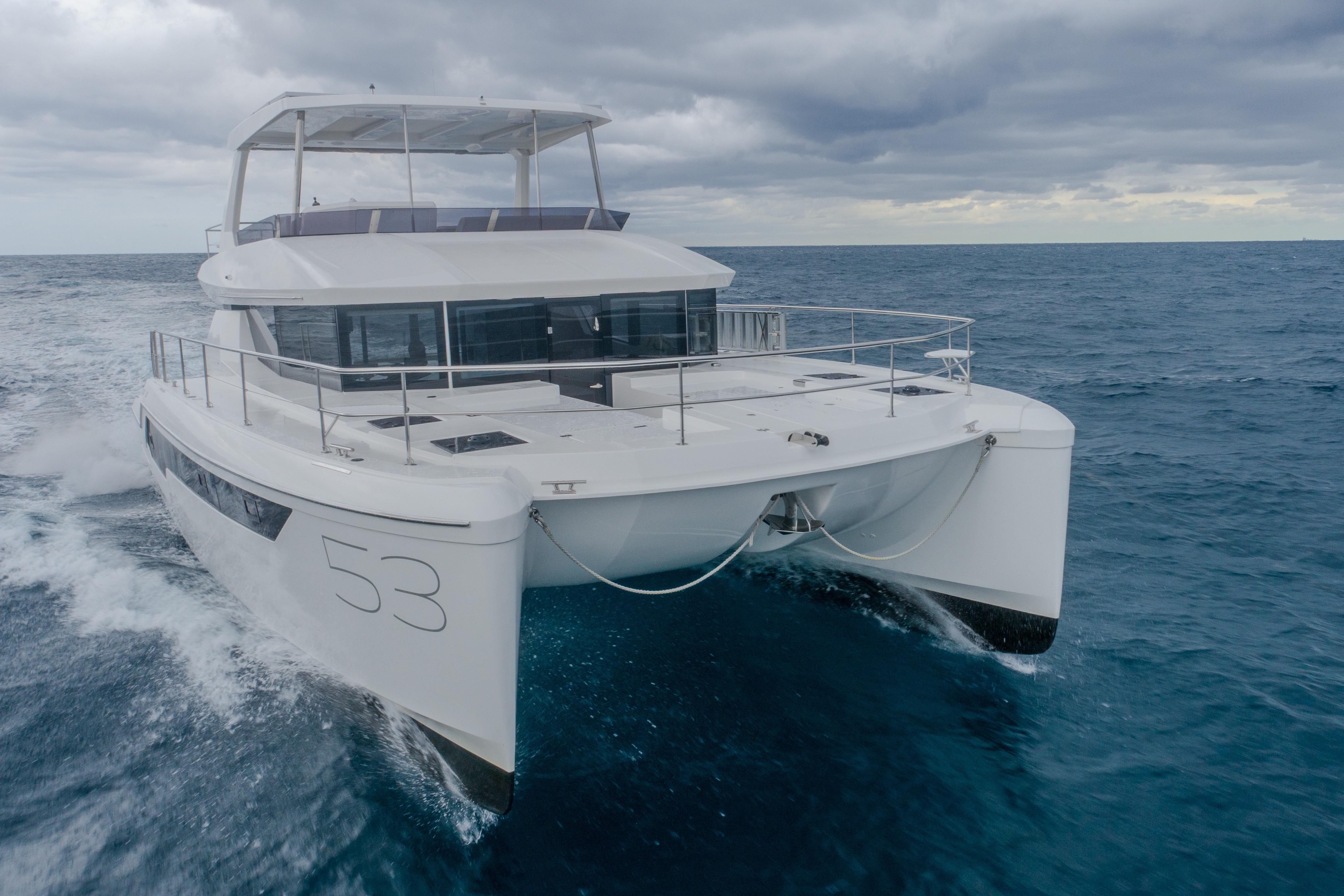 2025 Leopard 53 Powercat cruising on open sea under cloudy skies.