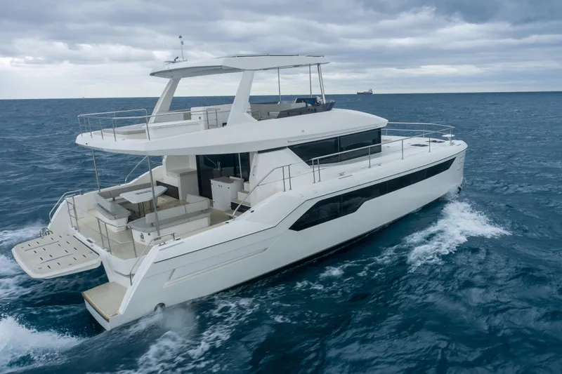 Althea Yacht Photos Pics 2025 Leopard 53 Powercat cruising on open sea under cloudy skies.