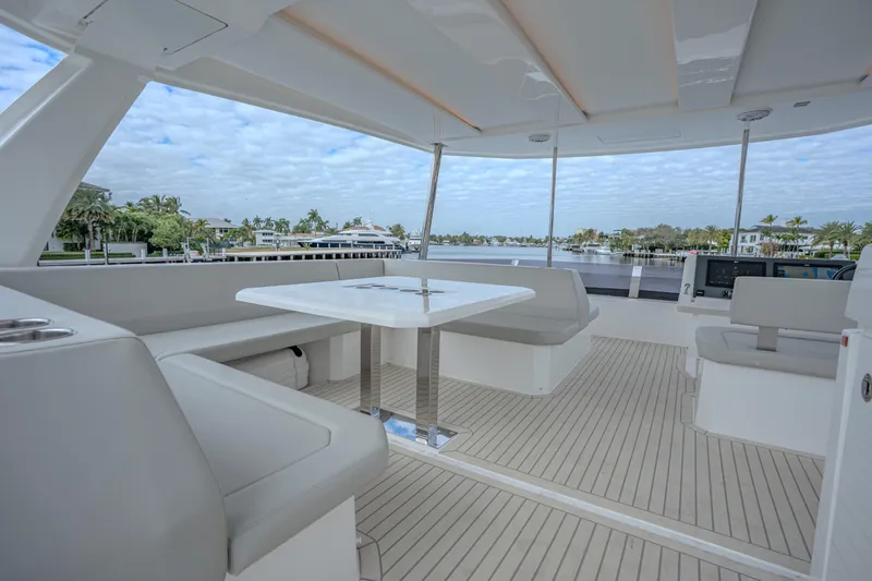 Althea Yacht Photos Pics Luxurious 2025 Leopard 53 Powercat yacht interior with spacious seating and scenic water views.