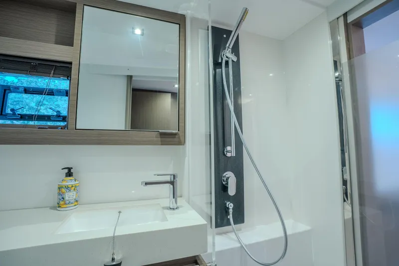 Althea Yacht Photos Pics Modern bathroom in 2025 Leopard 53 Powercat yacht with sleek fixtures and shower.